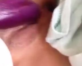 Asian girl fucking herself with an eggplant